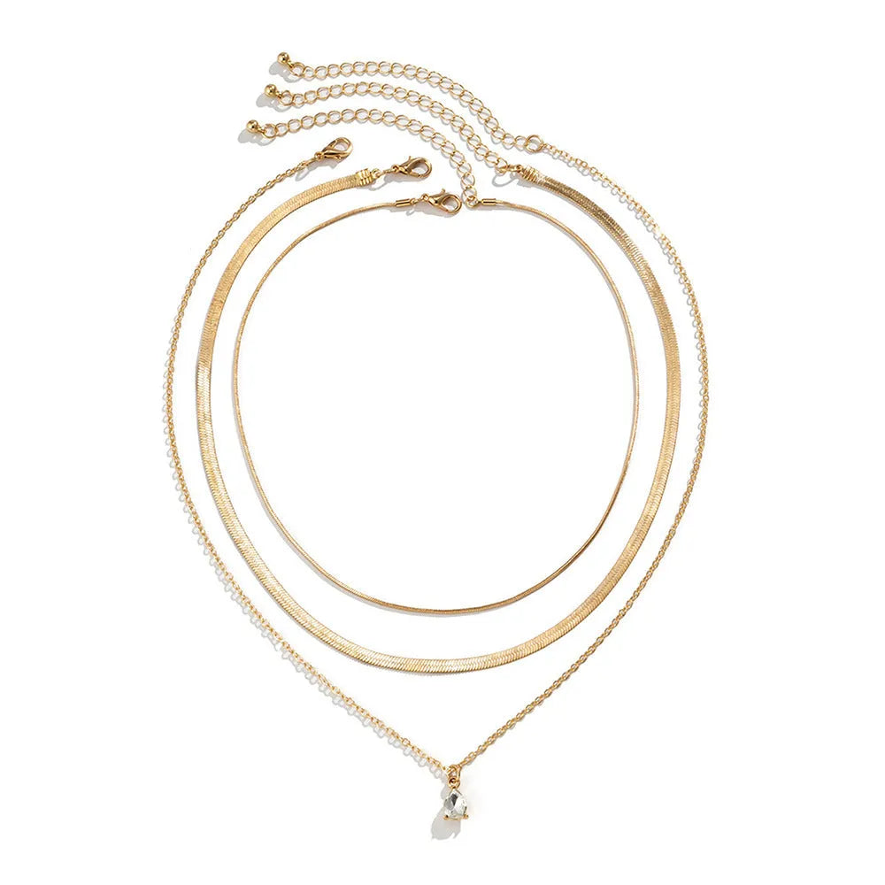 Gold and silver water drop shape alloy pendant necklace with electroplated finish on white background