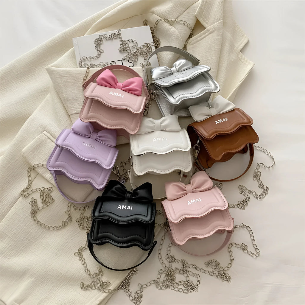 Mini crossbody bag in PU leather with adjustable strap shown in seven colour options
