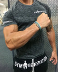 Short sleeve polyester workout top in orange, blue, grey, or light grey, sizes M to XXXL with size chart.