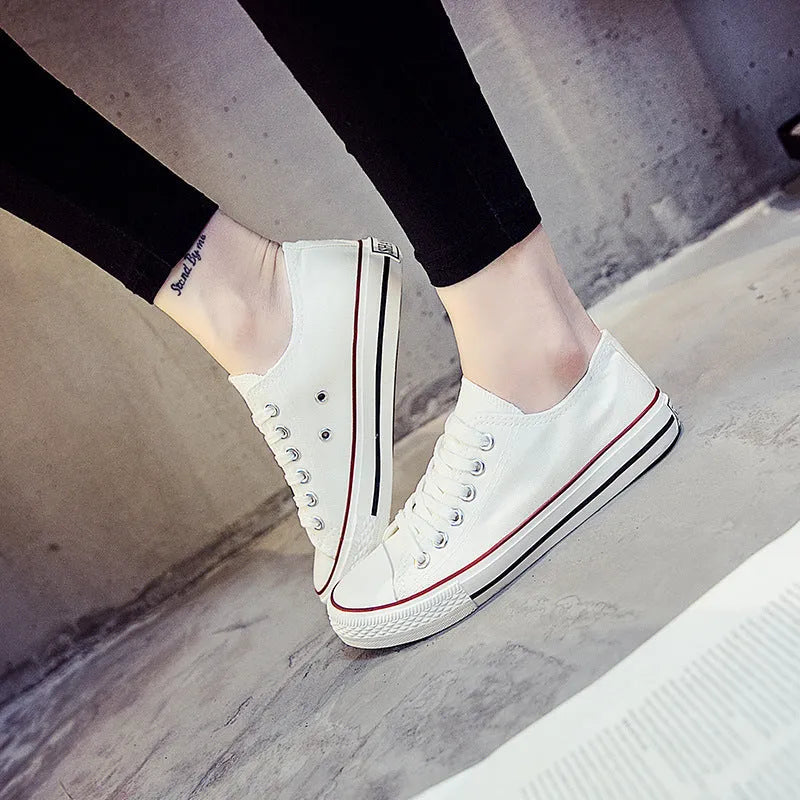 Women's canvas casual shoes in solid colours showing black, white black, white red, and all black options