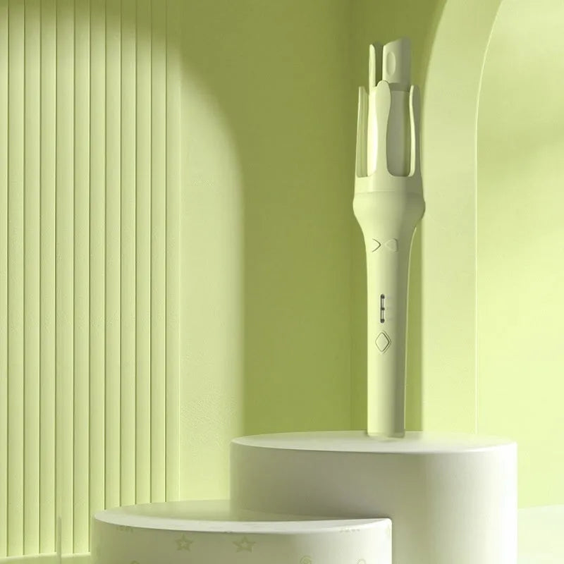 White and Chigo brand automatic hair curler with a 32mm barrel on a table.