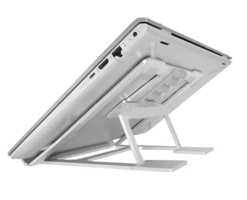 Foldable silver aluminium laptop stand with silicone grips on a desk, showing adjustable angle