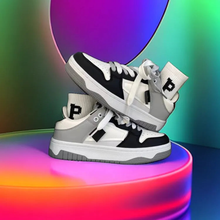 Low-top casual sneakers with synthetic leather upper, stitched detailing, and vulcanised rubber sole in white