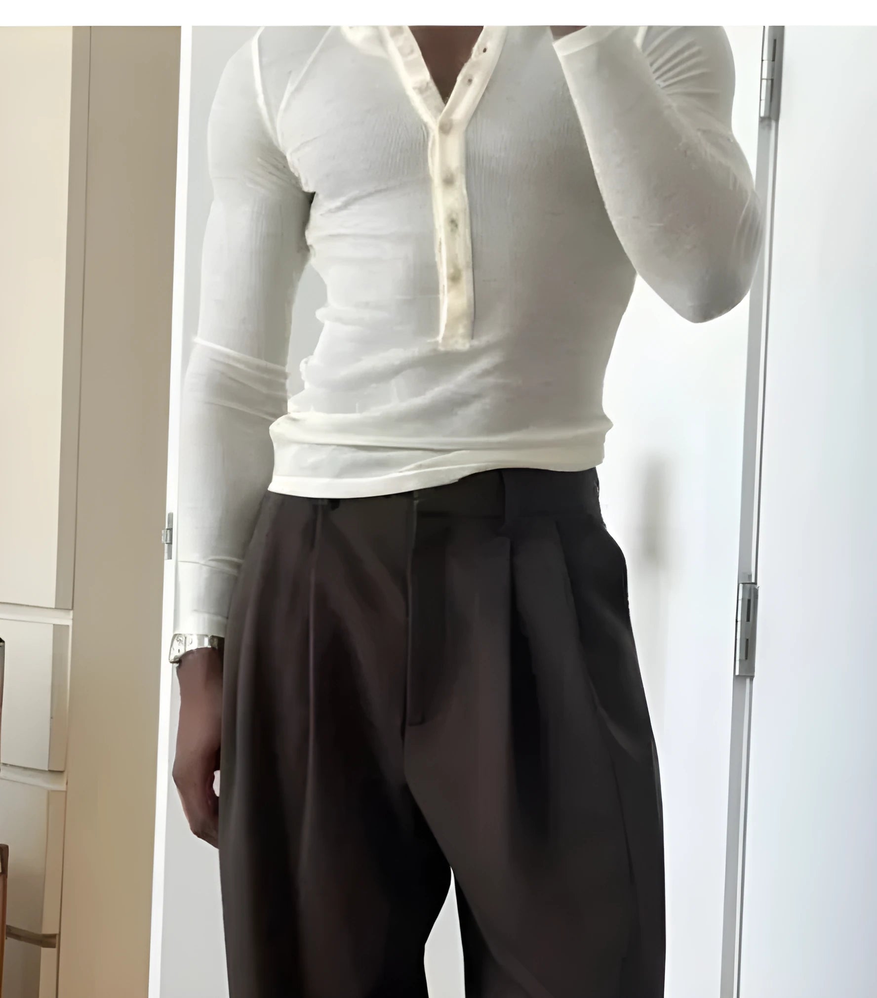 Men's cream-coloured ribbed long-sleeve henley top with a three-button placket.
