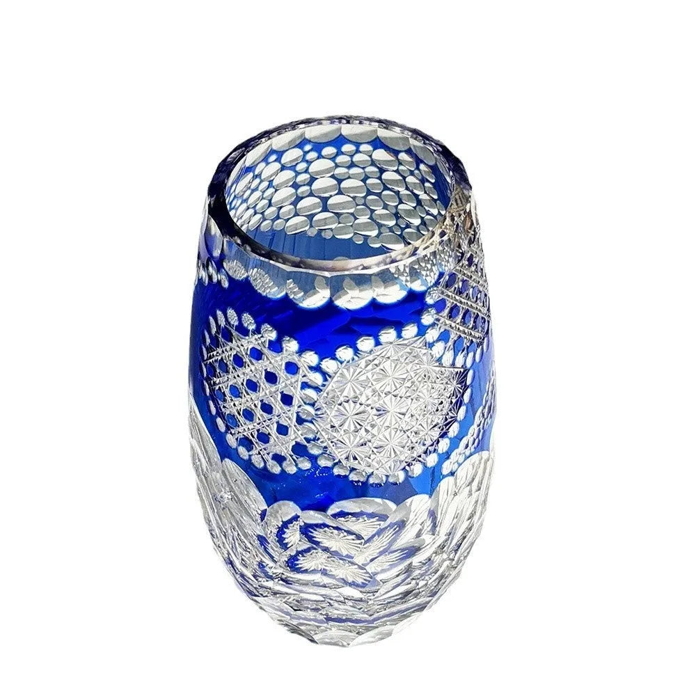 Blue Jianghu cut crystal glass tumbler 80x190mm on a wooden surface