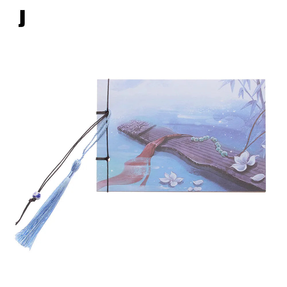 A5 kraft paper notebook with a hand-stitched binding and a hanging tassel bookmark in a natural design.