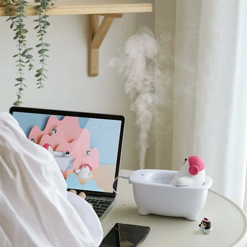 White USB air humidifier with 550ml water tank showing mist output and control buttons