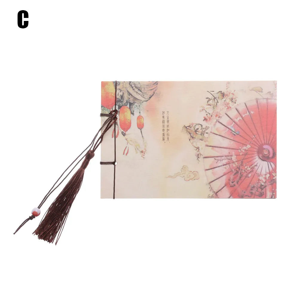 A5 kraft paper notebook with a hand-stitched binding and a hanging tassel bookmark in a natural design.