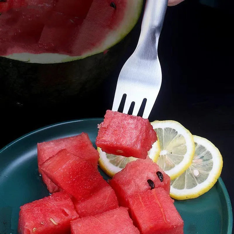 Stainless steel watermelon slicer and fork tool on a kitchen surface