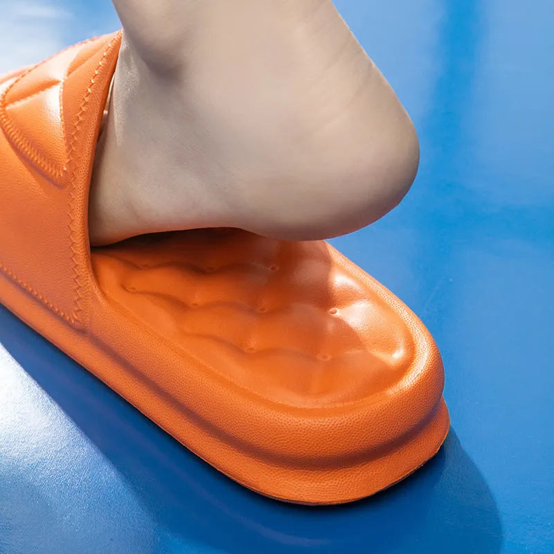 Pair of thick-sole EVA bathroom sandals in a chosen colour, showing soft upper and substantial non-slip base.