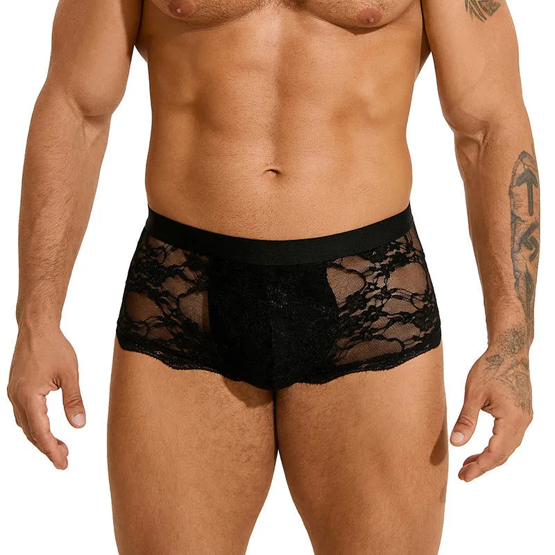 Men's black lace briefs with hollow-out see-through panels laid flat