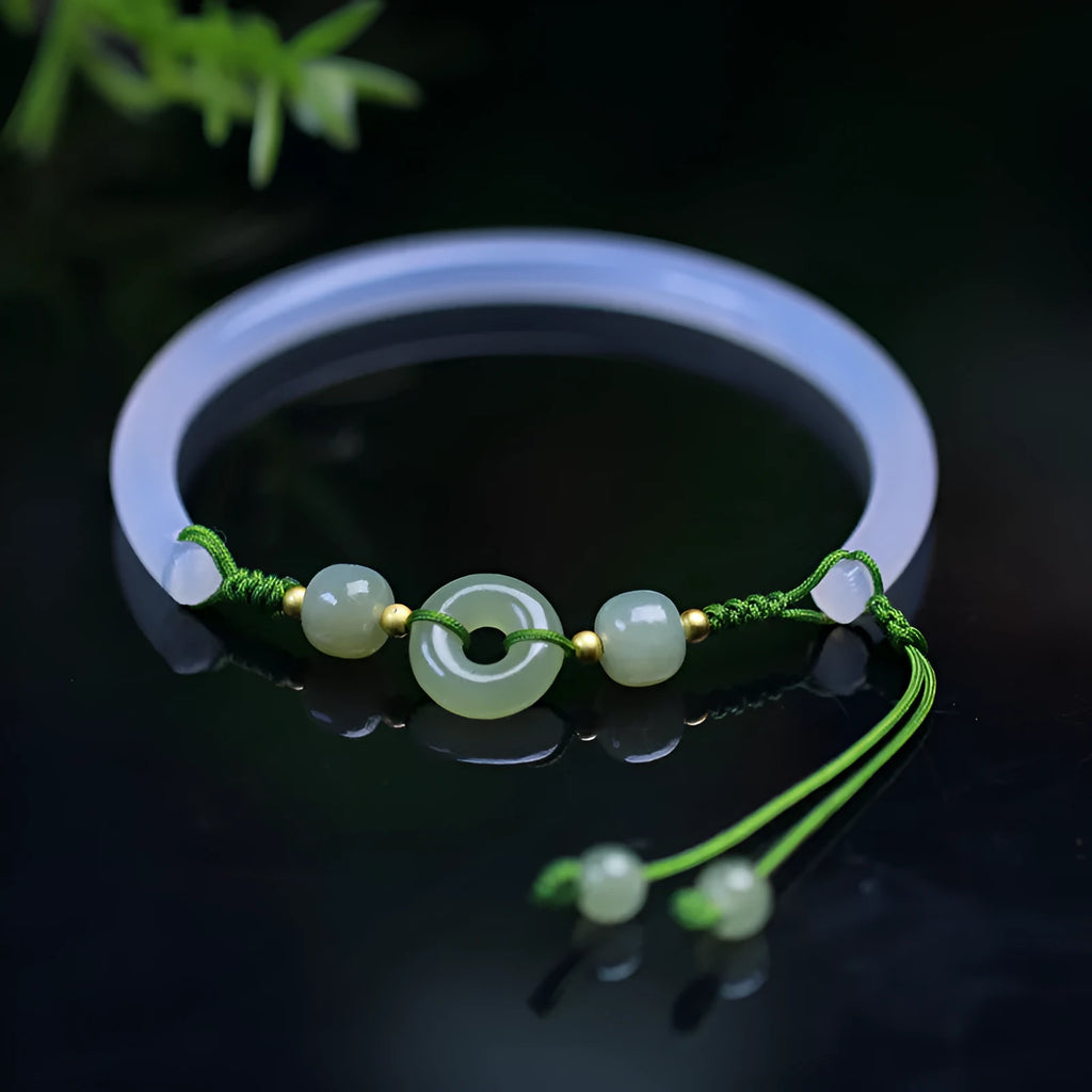 Hand-woven white agate bracelet with hetian jade accents and traditional peace buckle on wrist