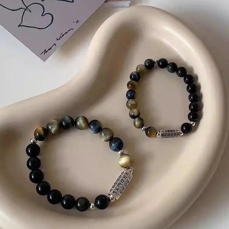 Sterling silver couple bracelet with tigereye obsidian gemstones and six words mantra design.