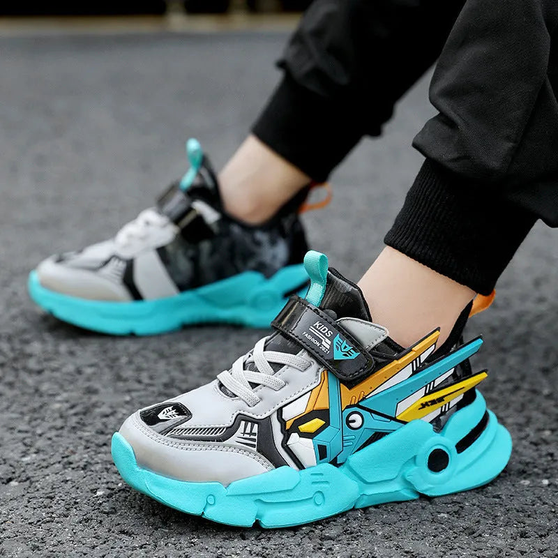 Boy's yellow artificial leather running shoes with Velcro strap and cartoon pattern, shown on a rubber sole.