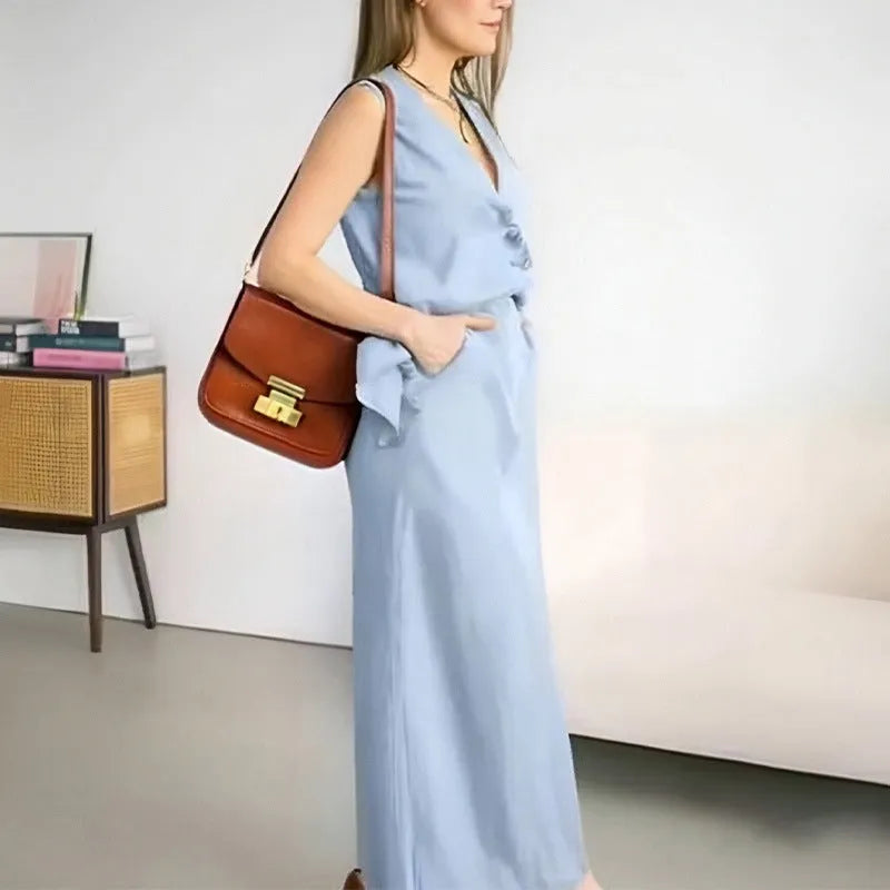 Blue casual sleeveless vest and long skirt two-piece set on a hanger.
