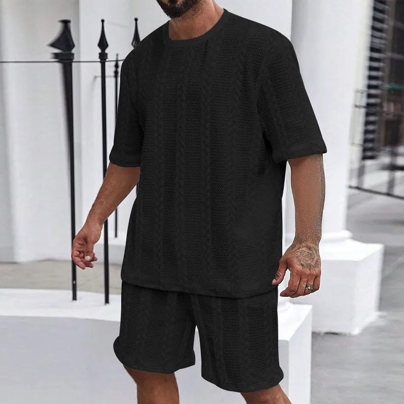 Knitted jacquard short sleeve pullover and matching shorts set in a solid colour on a hanger.