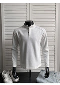 Men's grey asymmetric polo shirt with a patchwork stand-up collar and long sleeves.