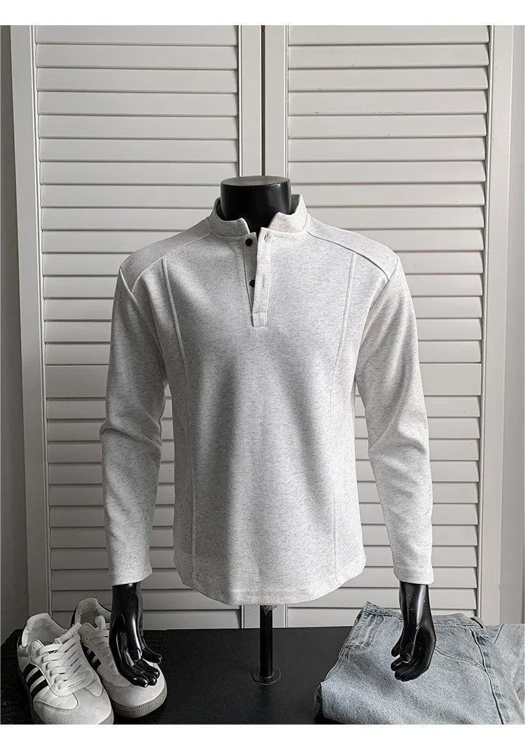 Men's grey asymmetric polo shirt with a patchwork stand-up collar and long sleeves.