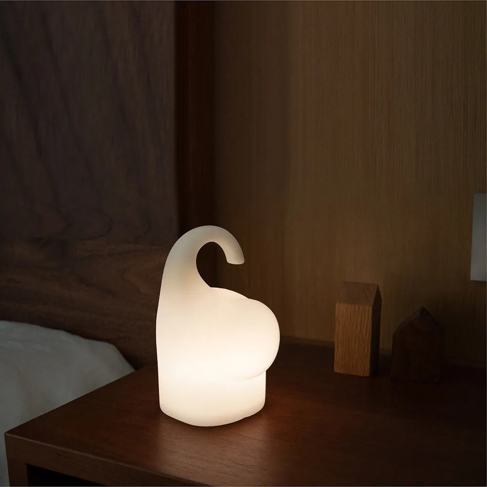 DOMI Elephant shaped night light with soft silicone body and warm white LED glow.