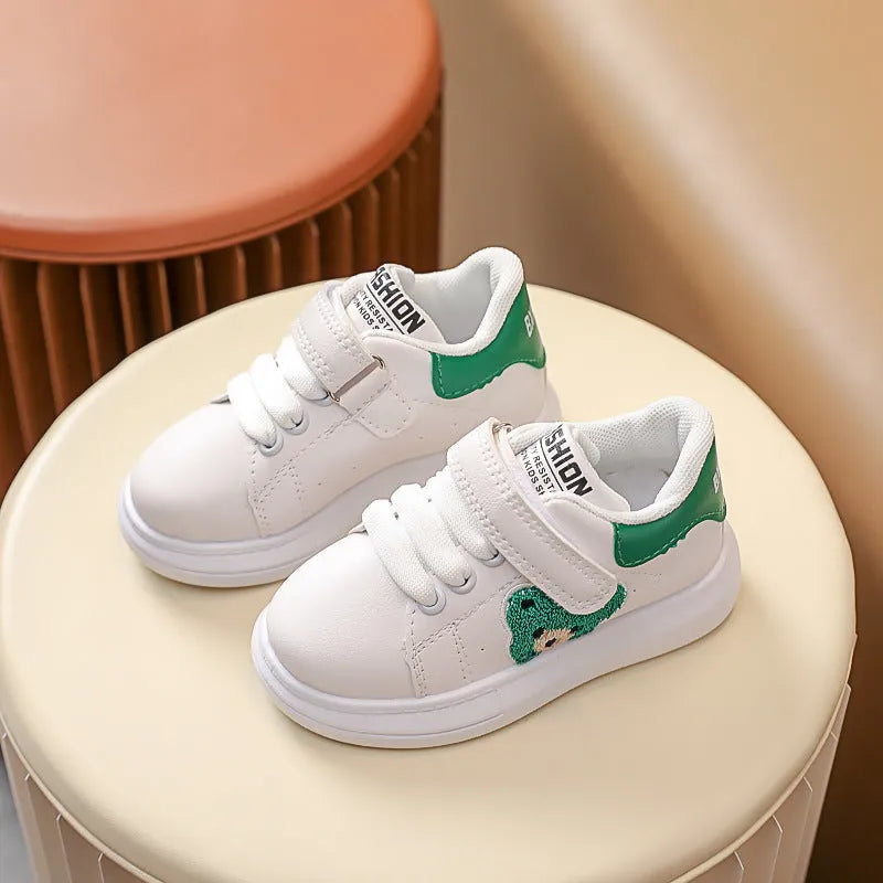 Baby Bear cartoon pattern children's sneakers in green, shown on a white background.