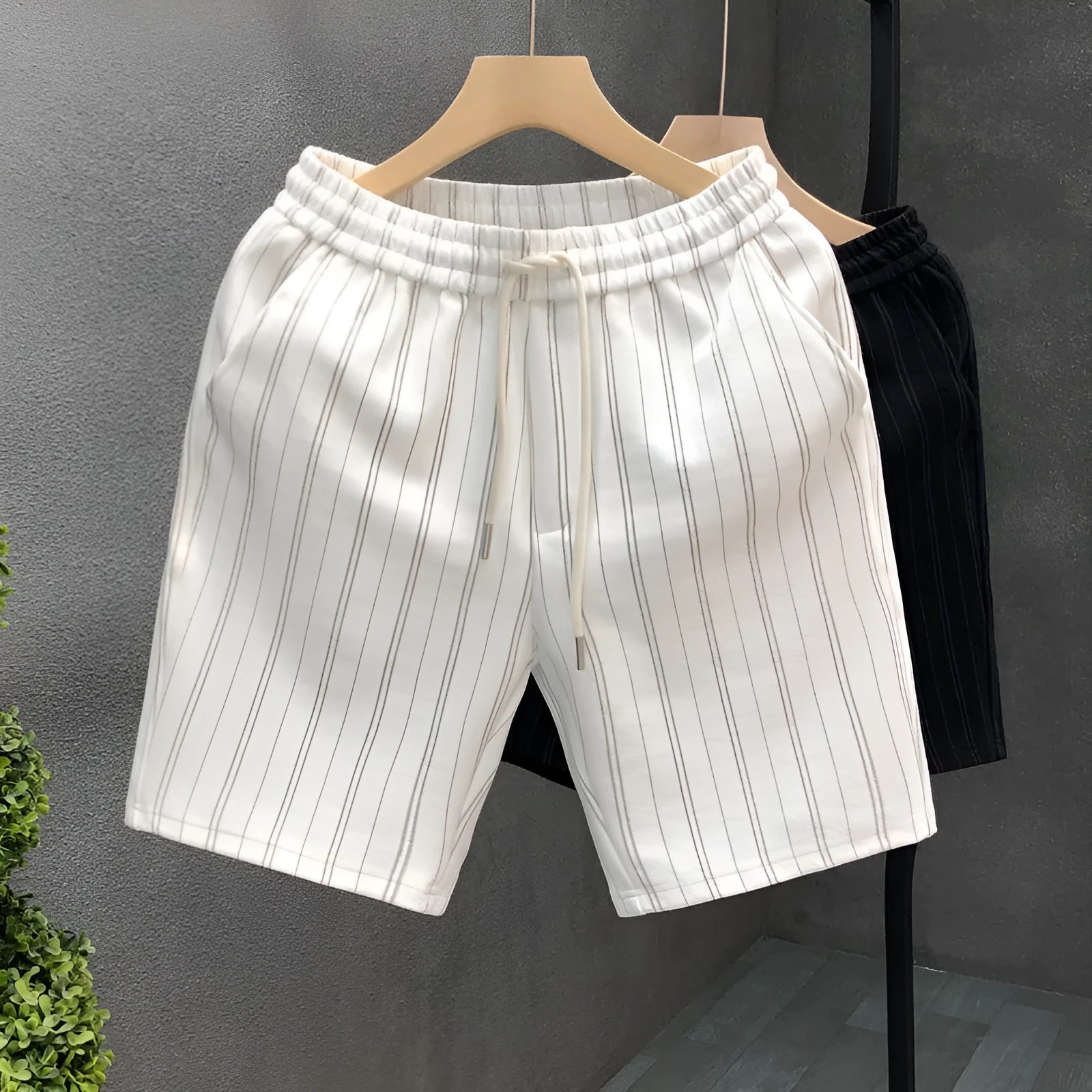 Men's black and white striped fleece-lined casual shorts with an elastic waistband