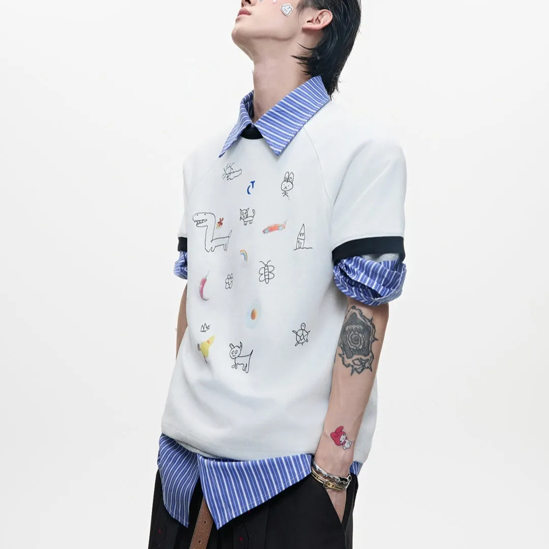Man wearing a loose fit blue short sleeve shirt with a large cartoon graphic print on the front.