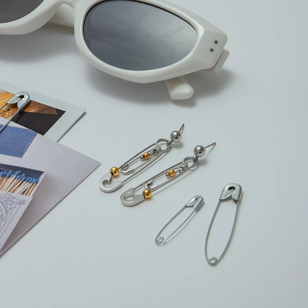 Stainless steel clip ear studs with geometric shape and electroplated finish for women