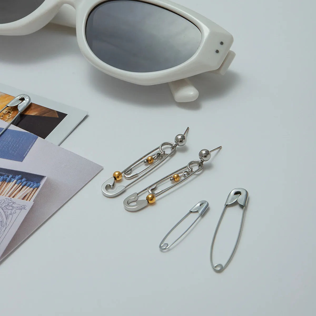 Stainless steel clip ear studs with geometric shape and electroplated finish for women
