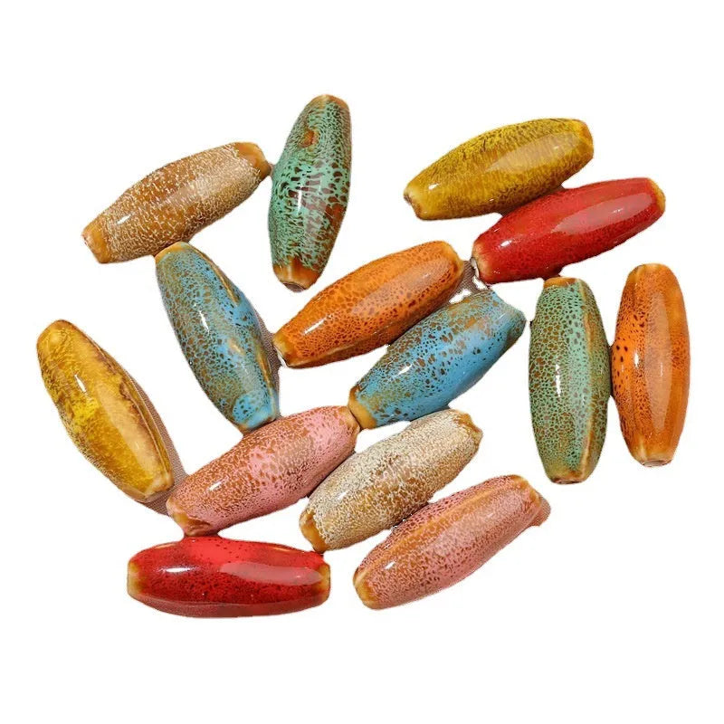 Ceramic bullet beads for jewellery making in eight glaze colours including pink, yellow, blue, red, coffee, green, orange, and mixed