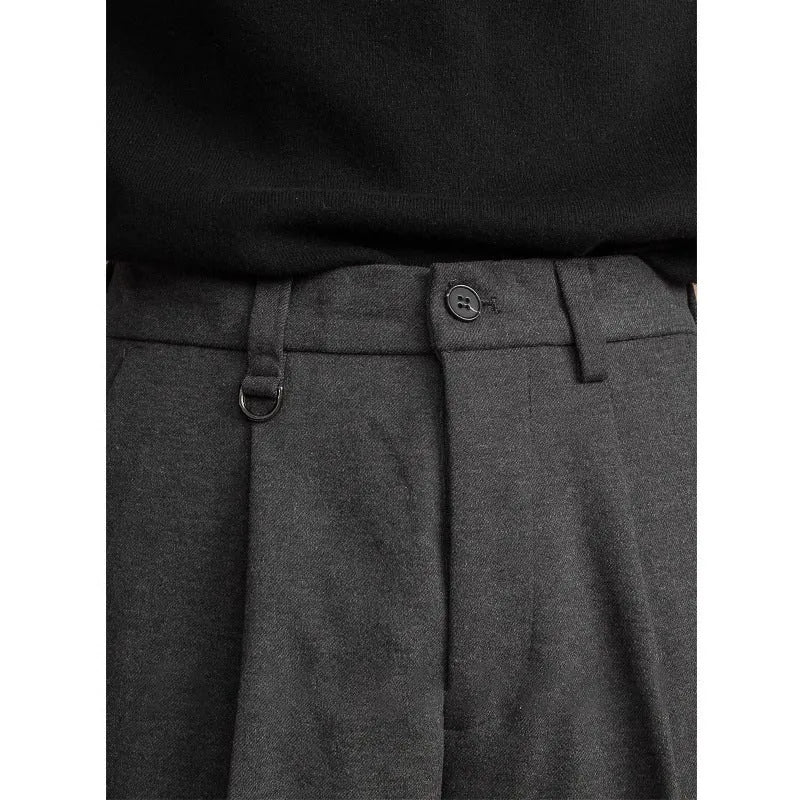 Men's straight-leg casual trousers in black with a draped design detail on the leg.