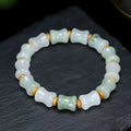 Natural chalcedony beaded bracelet with safety lock closure and diamond-shaped jade beads on elastic string