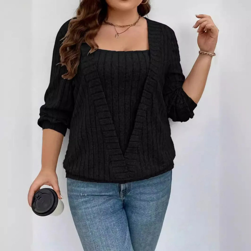 Women's loose fit long sleeve V-neck top in black ribbed polyester fabric with false two-piece suit detailing