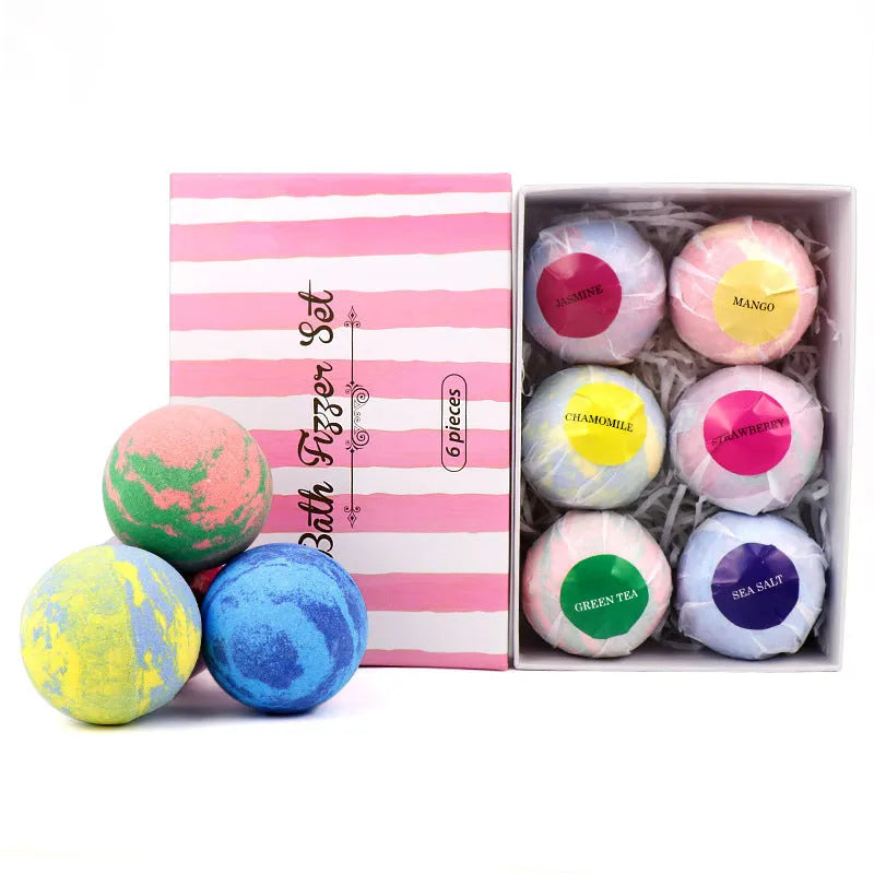 Set of six 60g mixed colour bath salt balls with essential oils and shea butter on a white background