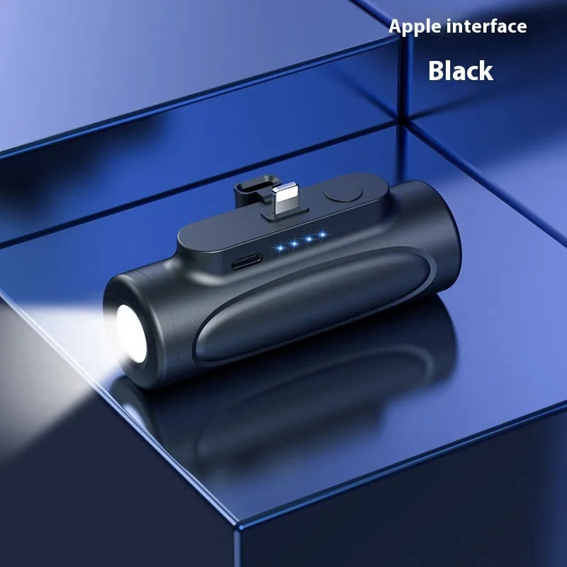 Black and pink portable power bank with a built-in LED flashlight, showing USB-C and Apple port options.