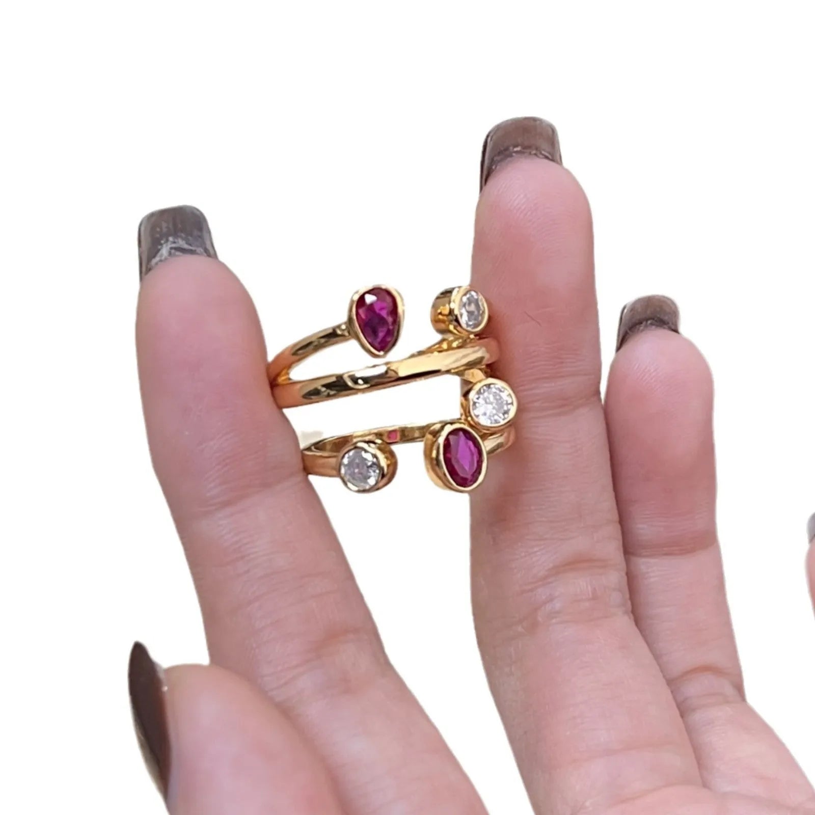 Double-headed copper ring with irregular cross shape and two-tone colour options.