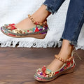 Women's plus size black ethnic platform sandals with cloth upper and elastic band, shown from the side.