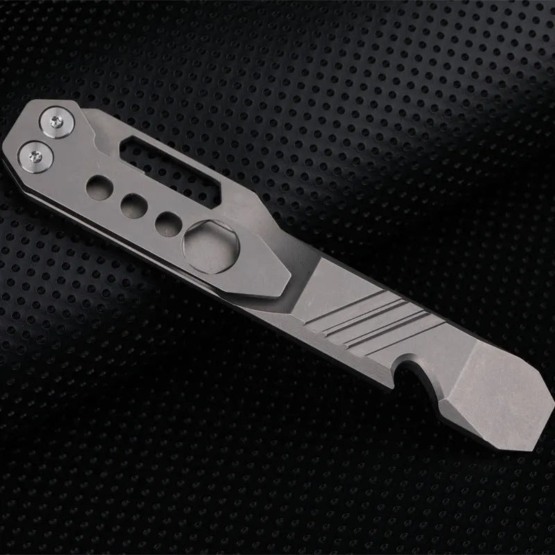 Titanium alloy multi-function crowbar tool with screwdriver tip and bottle opener in stone wash finish.