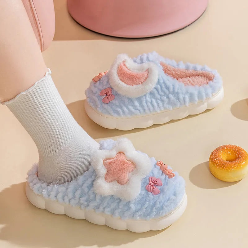 Women's light blue fleece-lined plush home slippers with round heel and PVC sole.