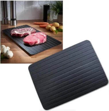 Black aluminium quick defrosting tray for thawing frozen meat and food without electricity.