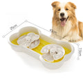Large green slow feeder dog bowl with three-tiered puzzle trays and anti-slip suction cups on the base.