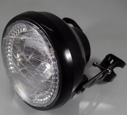 7-inch universal motorcycle headlight with integrated LED turn signals in black housing with black bracket