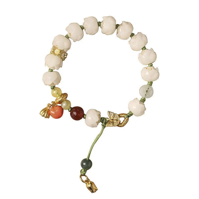 White jade Bodhi bracelet with hand-woven rope, lotus beads, and large pumpkin beads on an open ring design.