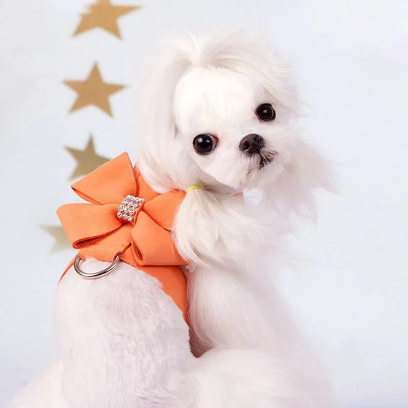 Pink microfiber dog chest strap with a bowknot, showing the harness design.