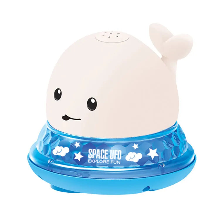Grey and white whale bath toy with water spray, LED lights, floating in water