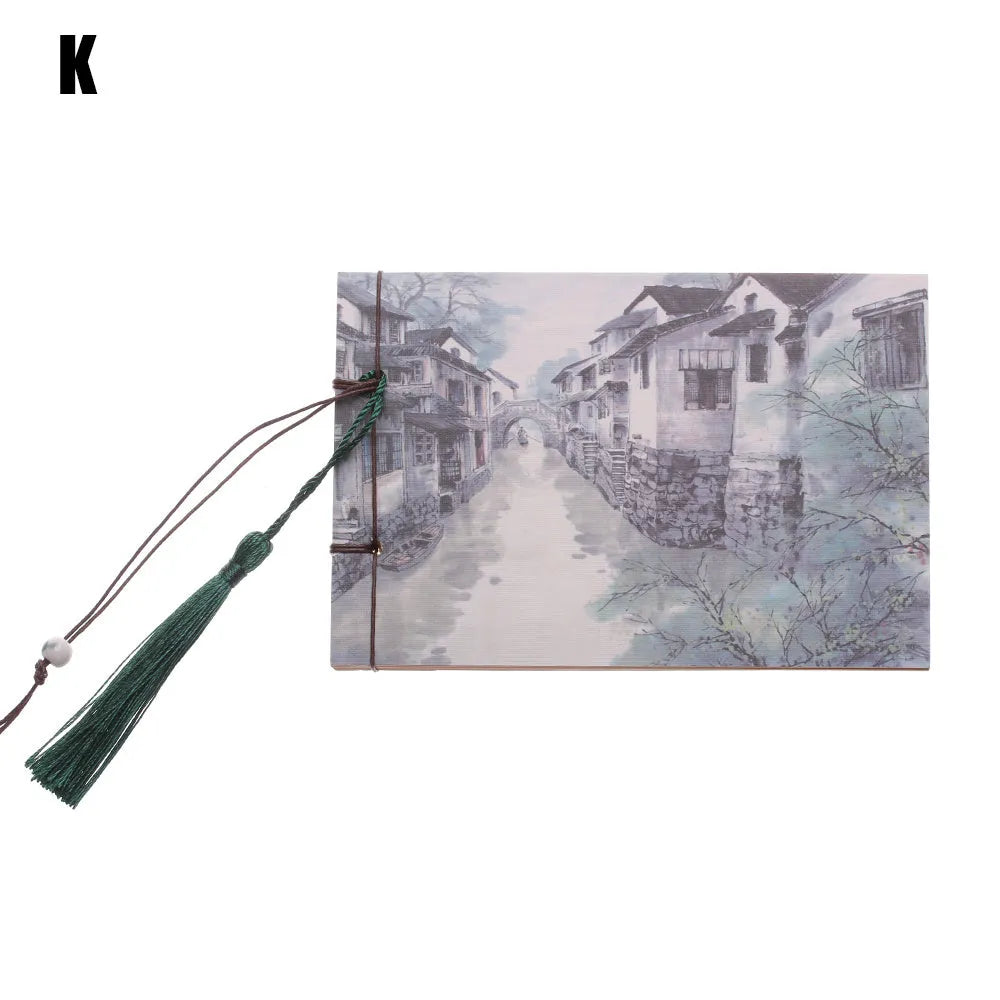 A5 kraft paper notebook with a hand-stitched binding and a hanging tassel bookmark in a natural design.