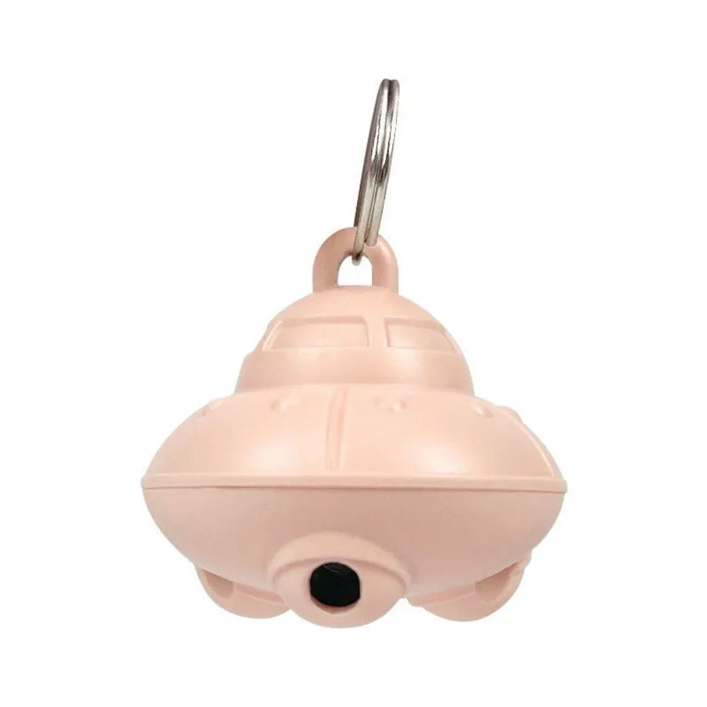 Automatic cat laser toy attached to green collar with USB charging port visible