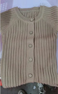 Baby long-sleeved knitted jumpsuit romper pullover in beige, size 80cm, lying flat on a white background