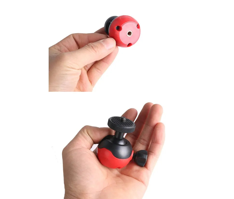 Black octopus tripod with flexible rubber legs wrapped around a pole holding a camera