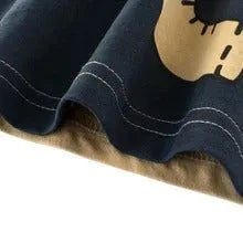 Children's cotton t-shirt with green lion print, showing size label for 120cm.