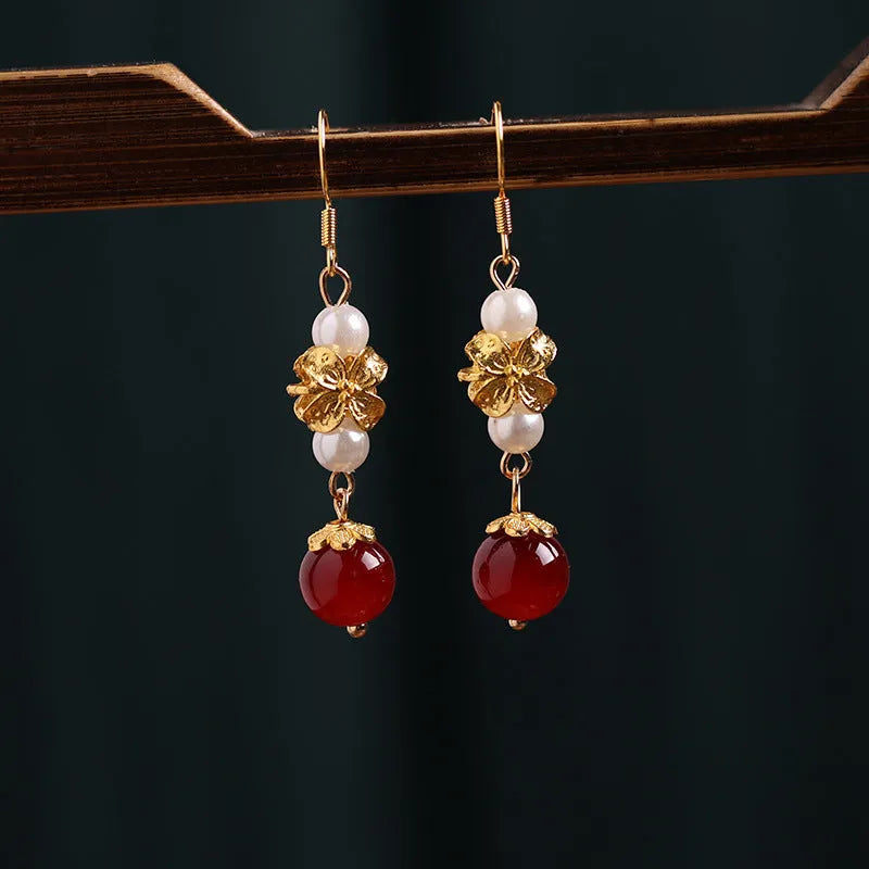 National Han Cheongsam antique earrings in geometric drop design with gold tone electroplated finish.
